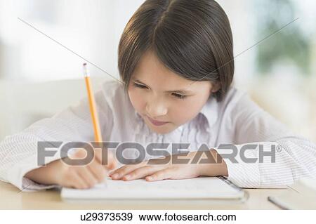 Girl (8-9) doing homework View Large Photo Image Stock Photo - Girl (8-9) doing homework. Fotosearch
