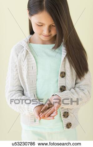 Girl (8-9) holding key View Large Photo Image Stock Photograph - Girl (8-9) holding key. Fotosearch