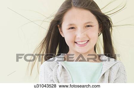 Girl (8-9) smiling, portrait View Large Photo Image Stock Photo - Girl (8-9) smiling, portrait. Fotosearch