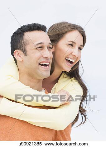 Stock Photography - Happy young couple embracing. Fotosearch