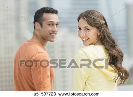 Happy young couple on walk View Large Photo Image Stock Image - Happy young couple on walk. Fotosearch