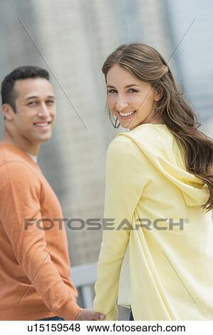 Happy young couple on walk View Large Photo Image Stock Photo - Happy young couple on walk. Fotosearch
