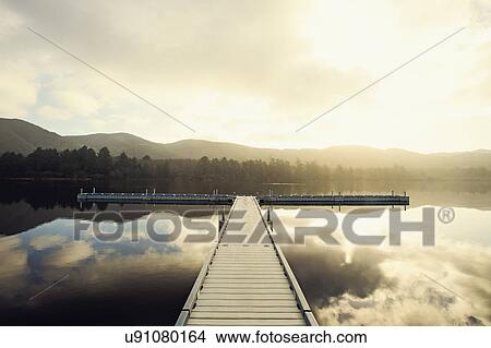 Picture - Landscape with sky reflected in water. Fotosearch