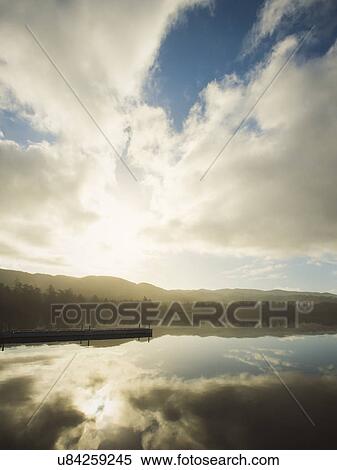 Landscape with sky reflected in water View Large Photo Image Stock Photography - Landscape with sky reflected in water. Fotosearch