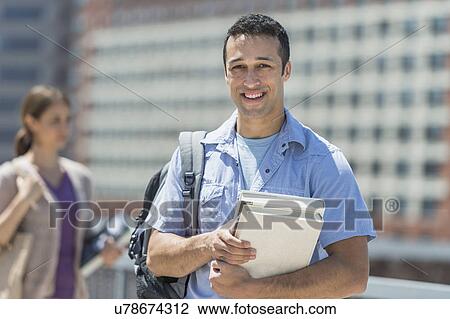 Male and female students in campus View Large Photo Image Stock Image - Male and female students in campus. Fotosearch