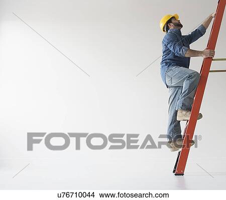 Man climbing up ladder View Large Photo Image Picture - Man climbing up ladder. Fotosearch