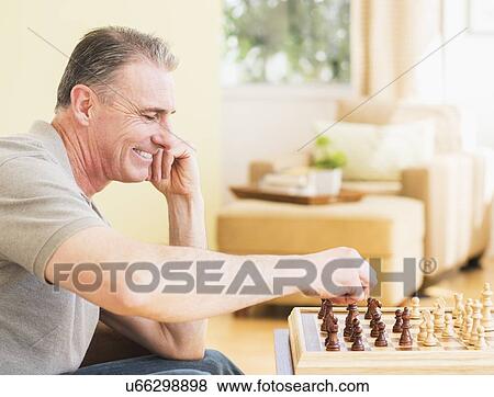 Man playing chess View Large Photo Image Stock Photo - Man playing chess. Fotosearch
