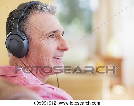 Stock Image - Man with headphones. Fotosearch