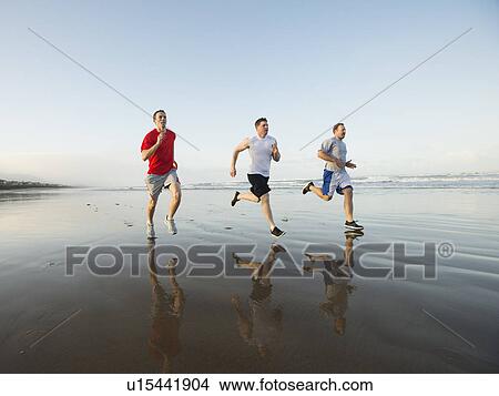 Men running on beach View Large Photo Image Picture - Men running on beach. Fotosearch