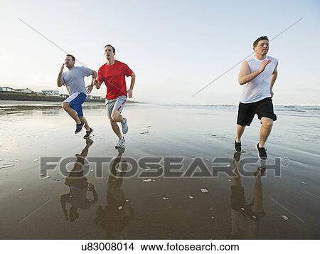 Men running on beach View Large Photo Image Picture - Men running on beach. Fotosearch