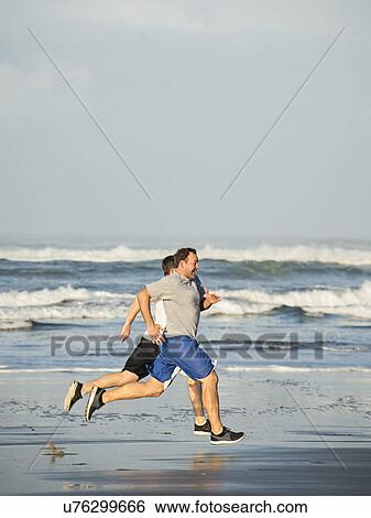 Men running on beach View Large Photo Image Stock Photograph - Men running on beach. Fotosearch