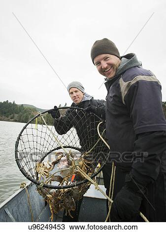 Men showing crabs in net View Large Photo Image Stock Image - Men showing crabs in net. Fotosearch