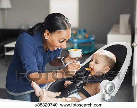Mother feeding baby (2-5 moths) View Large Photo Image Stock Image - Mother feeding baby (2-5 moths). Fotosearch