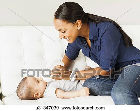 Mother feeding baby (2-5 moths) View Large Photo Image Stock Photo - Mother feeding baby (2-5 moths). Fotosearch