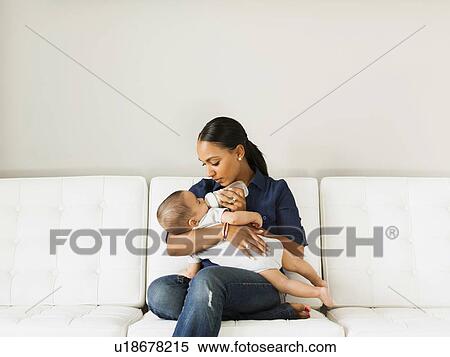 Mother feeding baby (2-5 moths) View Large Photo Image Stock Photography - Mother feeding baby (2-5 moths). Fotosearch