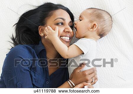 Mother hugging her son (2-5 months) View Large Photo Image Stock Photo - Mother hugging her son (2-5 months). Fotosearch