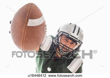 Stock Image - Portrait of American football player . Fotosearch