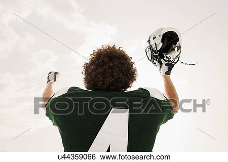 Portrait of American football player celebrating victory View Large Photo Image Stock Photograph - Portrait of American football player celebrating victory. Fotosearch