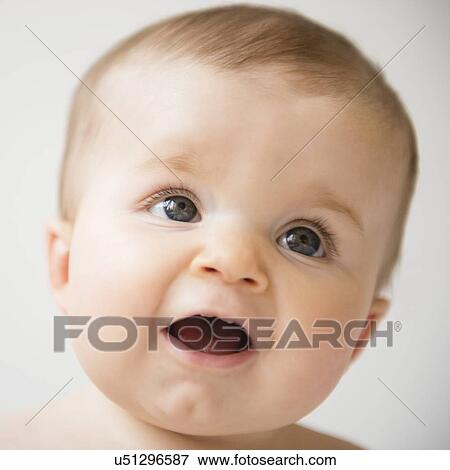 Stock Photo - Portrait of baby girl (6-11 months). Fotosearch
