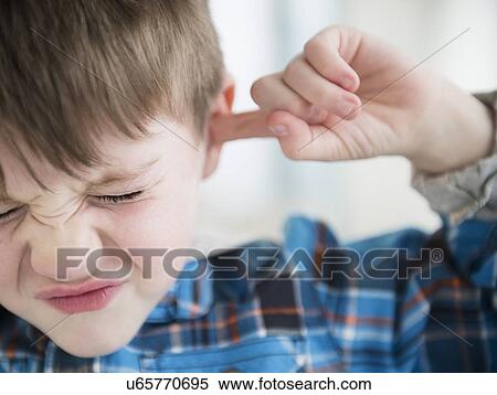 Portrait of boy (4-5) sticking fingers in his ears View Large Photo Image Stock Photography - Portrait of boy (4-5) sticking fingers in his ears. Fotosearch