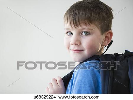 Portrait of boy (4-5) with backpack View Large Photo Image Picture - Portrait of boy (4-5) with backpack. Fotosearch