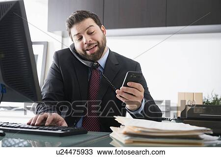 Portrait of busy man in office View Large Photo Image Stock Image - Portrait of busy man in office. Fotosearch