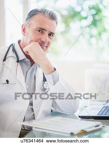 Portrait of doctor in his office View Large Photo Image Picture - Portrait of doctor in his office. Fotosearch