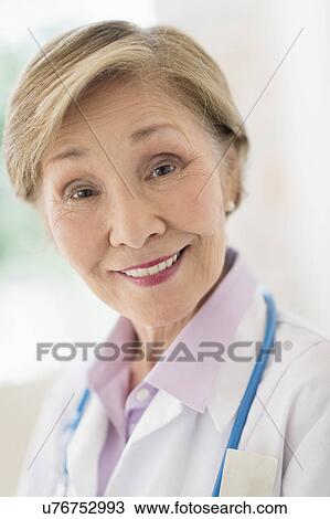 Portrait of female doctor View Large Photo Image Stock Image - Portrait of female doctor. Fotosearch