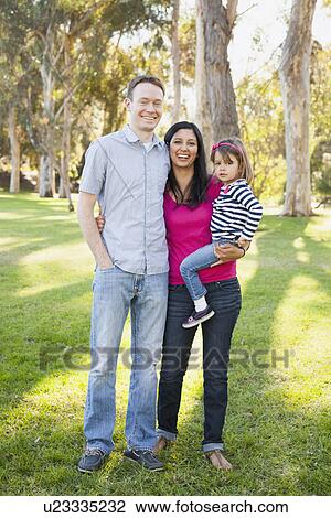Portrait of happy family in park View Large Photo Image Stock Image - Portrait of happy family in park. Fotosearch