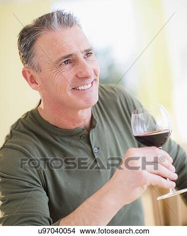 Picture - Portrait of man drinking red wine. Fotosearch