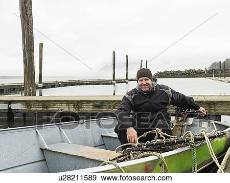Portrait of man in boat View Large Photo Image Stock Photo - Portrait of man in boat. Fotosearch