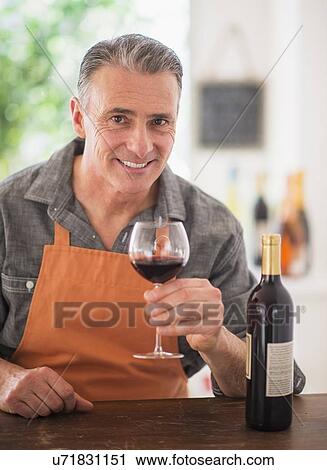Portrait of man tasting wine View Large Photo Image Stock Image - Portrait of man tasting wine. Fotosearch