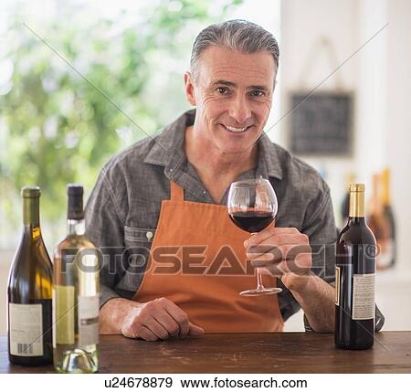 Stock Photo - Portrait of man tasting wine. Fotosearch