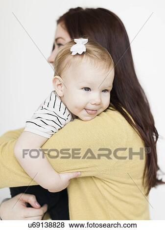 Portrait of mother with daughter (12-17 months) View Large Photo Image Stock Photo - Portrait of mother with daughter (12-17 months). Fotosearch
