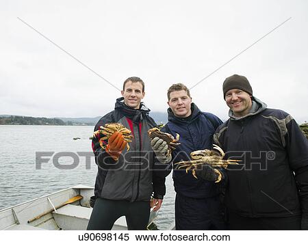 Portrait of people holding crabs View Large Photo Image Stock Photography - Portrait of people holding crabs. Fotosearch