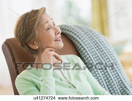Picture - Portrait of senior woman at home. Fotosearch
