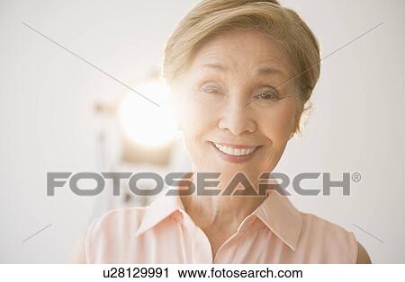 Portrait of senior woman smiling View Large Photo Image Stock Image - Portrait of senior woman smiling. Fotosearch