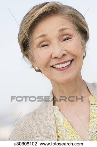 Stock Image - Portrait of senior woman smiling. Fotosearch