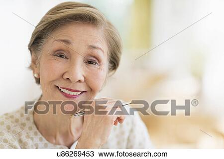 Portrait of senior woman smiling View Large Photo Image Stock Image - Portrait of senior woman smiling. Fotosearch