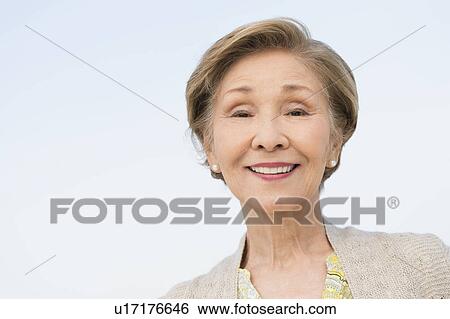 Portrait of senior woman smiling View Large Photo Image Stock Photograph - Portrait of senior woman smiling. Fotosearch