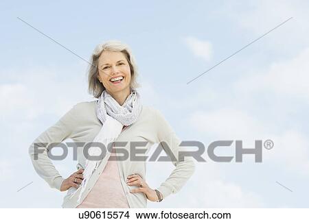 Picture - Portrait of senior woman standing outdoors. Fotosearch