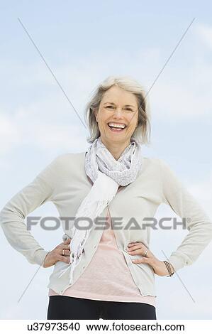 Portrait of senior woman standing outdoors View Large Photo Image Stock Image - Portrait of senior woman standing outdoors. Fotosearch