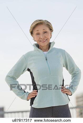 Stock Photo - Portrait of senior woman stretching. Fotosearch