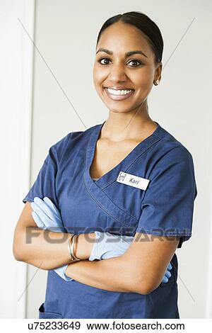 Stock Photo - Portrait of smiling female nurse. Fotosearch