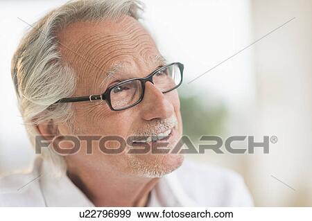 Stock Photo - Portrait of smiling senior man. Fotosearch