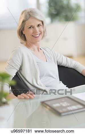 Portrait of smiling senior woman View Large Photo Image Stock Image - Portrait of smiling senior woman. Fotosearch