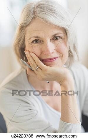 Portrait of smiling senior woman View Large Photo Image Stock Photo - Portrait of smiling senior woman. Fotosearch