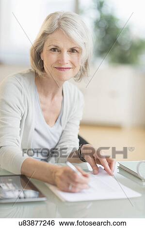 Stock Photograph - Portrait of smiling senior woman. Fotosearch