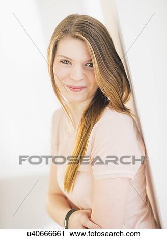 Stock Image - Portrait of smiling woman. Fotosearch