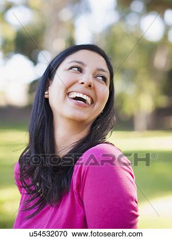 Stock Image - Portrait of smiling woman. Fotosearch